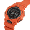 Reloj Casio G-Shock esfera negra, exterior y correa naranja.