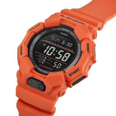 Reloj Casio G-Shock esfera negra, exterior y correa naranja.