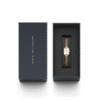 Reloj Daniel Wellington esfera en blanco con toques dorados y exterior dorado.