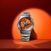 Reloj Casio G-Shock esfera naranja y exterior acero.