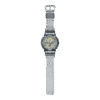 Reloj Casio G-Shock esfera dorada y exterior gris transparente.