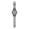 Reloj Casio G-Shock esfera dorada y exterior gris transparente.