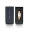 Reloj Daniel Wellington esfera en dorado y en blanco y exterior dorado.