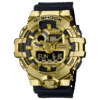 Reloj Casio G-Shock con esfera de color dorado toques negros y correa en color negro.