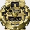 Reloj Casio G-Shock con esfera de color dorado toques negros y correa en color negro.